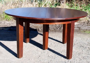 Gustav Stickley original 60 inch diameter oak 5 leg dining table with 5 leaves, opens to 10 feet.